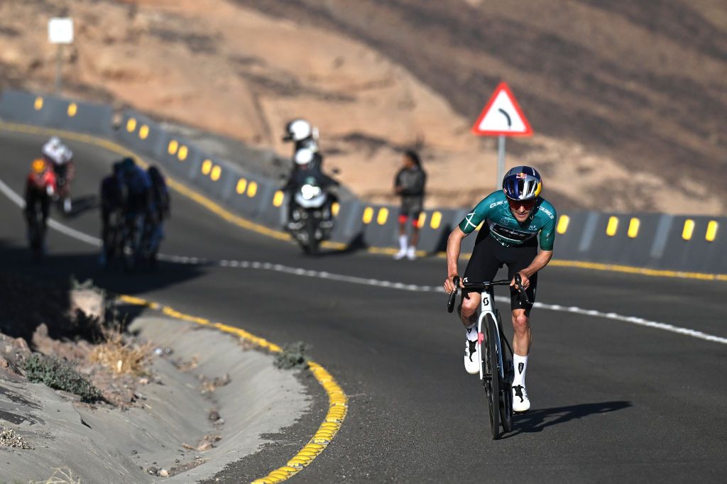 SKYVIEWS OF HARRAT UWAYRID SAUDI ARABIA JANUARY 31 Tom Pidcock of The United Kingdom and Q365 Pro Cycling Team Green Leader Jersey attacks in the final climb during the 5th AlUla Tour 2025 Stage 4 a 1409km stage from Maraya to Skyviews of Harrat Uwayrid 1159m on January 31 2025 in Skyviews of Harrat Uwayrid Saudi Arabia Photo by Szymon GruchalskiGetty Images