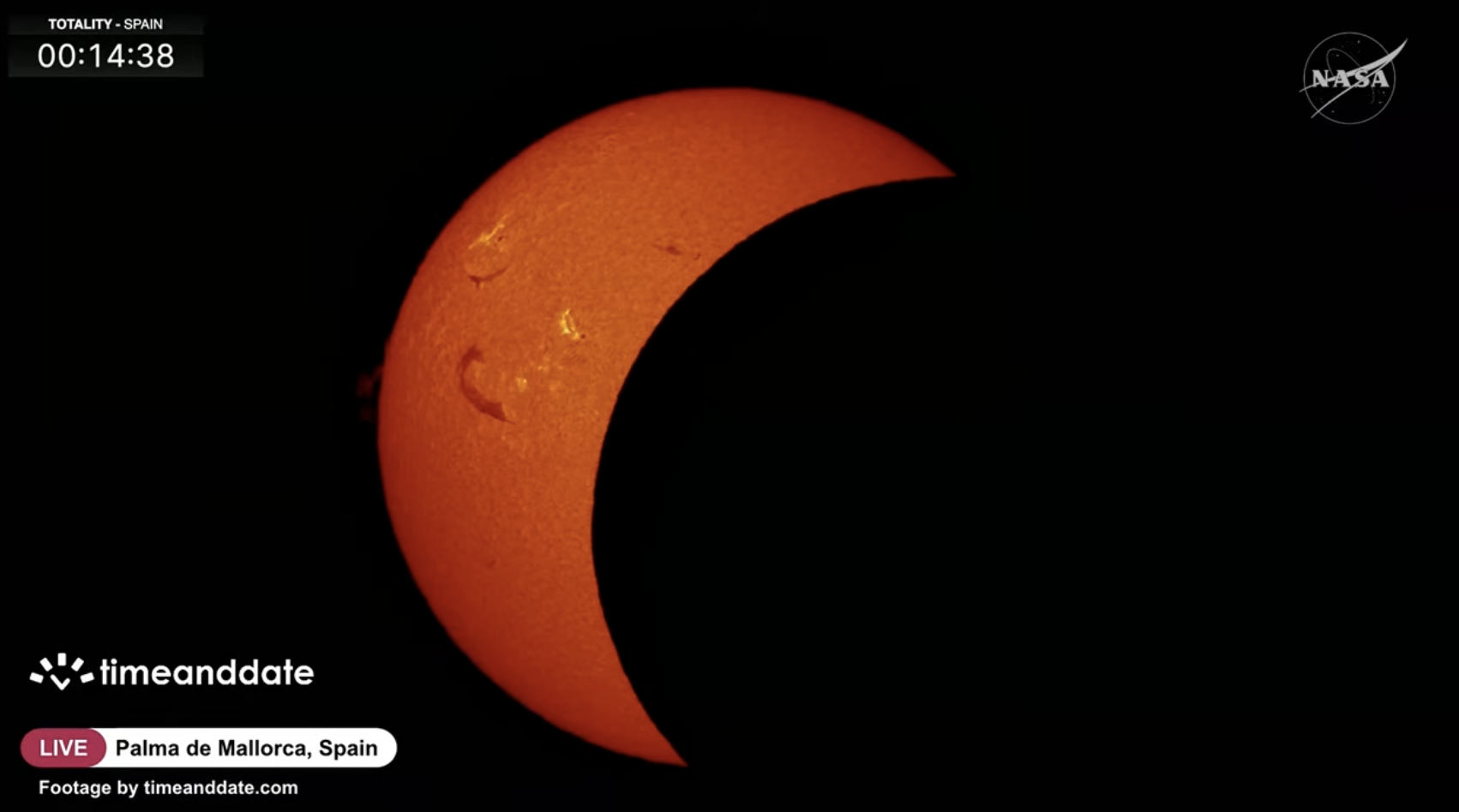 A view of the partial phase of the eclipse over Spain, courtesy of timeanddate.com and NASA's livestream