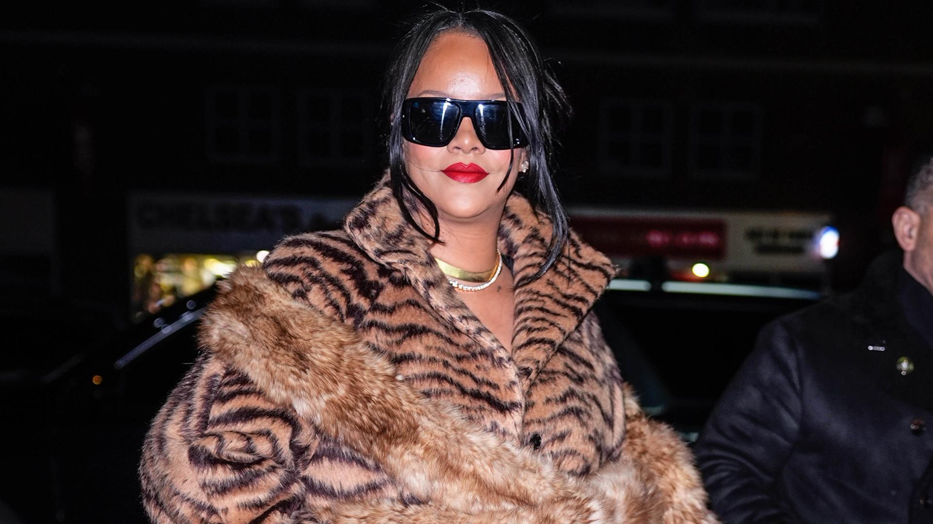 Rihanna approved the tiger print trend in a fur coat and matching ankle-strap pumps