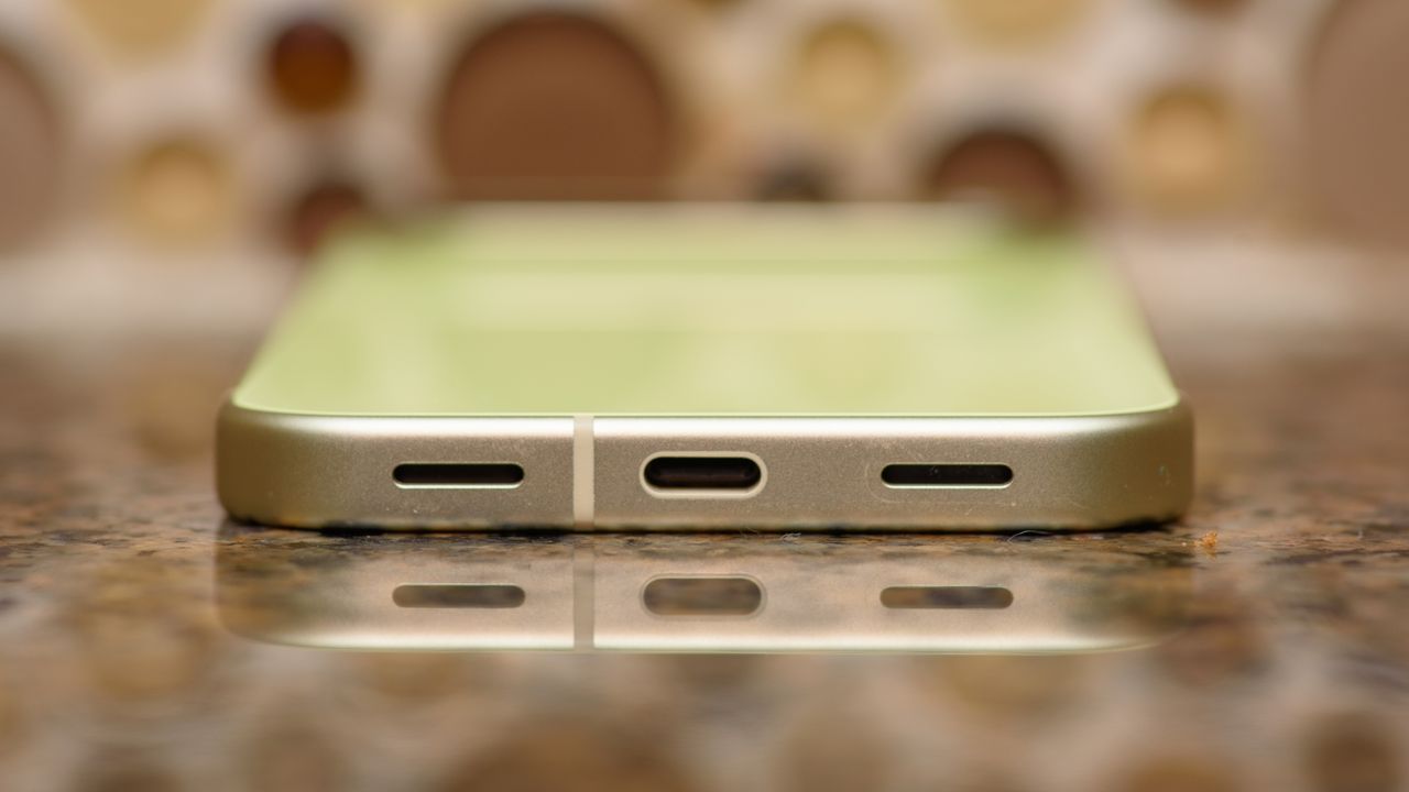 Google Pixel 10 in Lemongrass against a bubbly backsplash