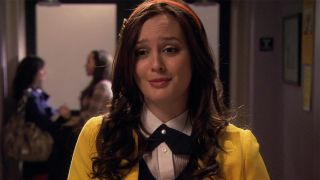 Leighton Meester wears a yellow coat with red headband and tights in Gossip Girl.