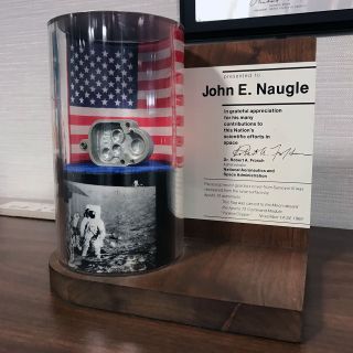 The scoop motor gear box cover from Surveyor 3 was presented to NASA chief scientist John Naugle. Today is at NASA Headquarters in Washington, DC.