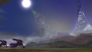 A picture of Spasm, a reclaimed map from Halo, featuring a looming ring in the distance and two lonesome buggies on the grass.
