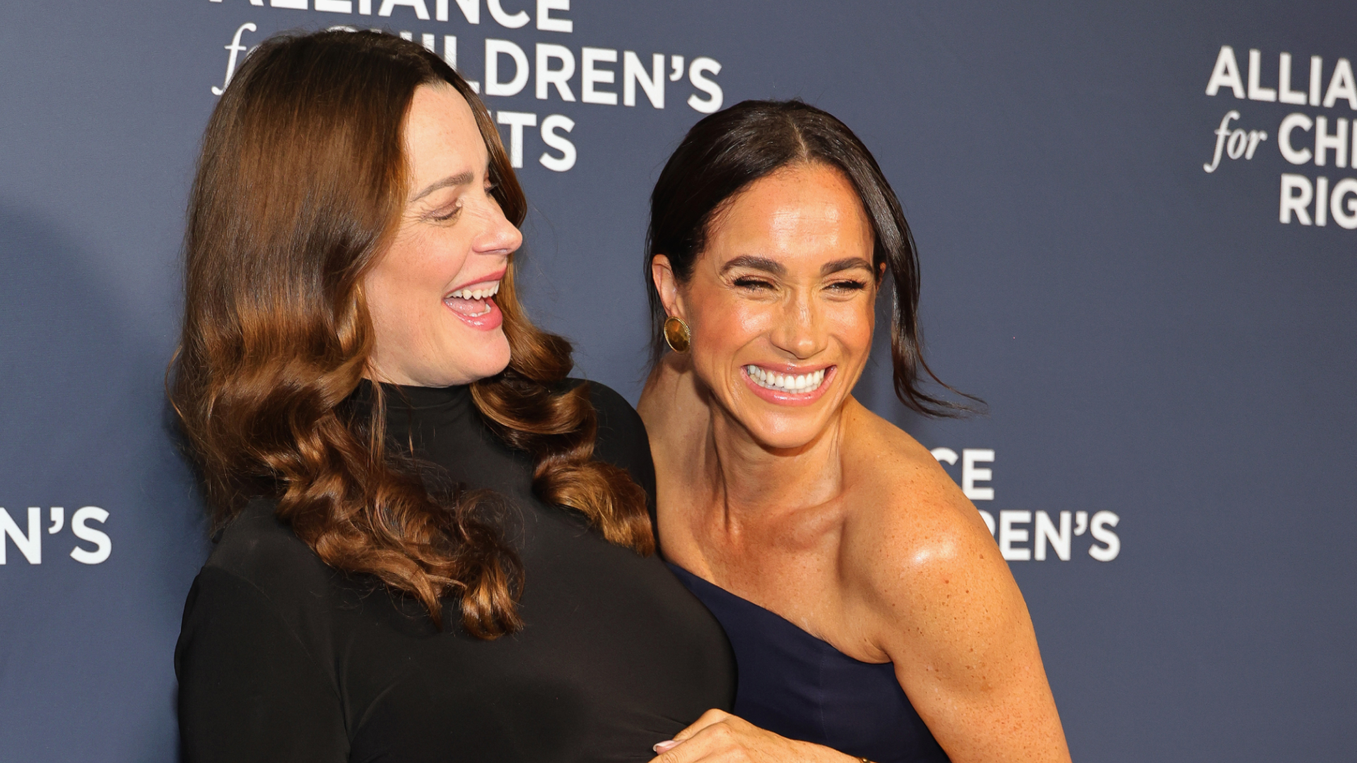 Meghan Markle wears a Ralph Lauren strapless gown