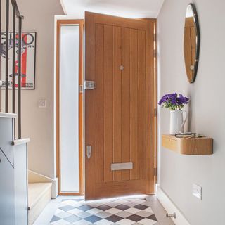 door with stair case and white wall