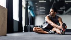 A man doing stretches during his rest day