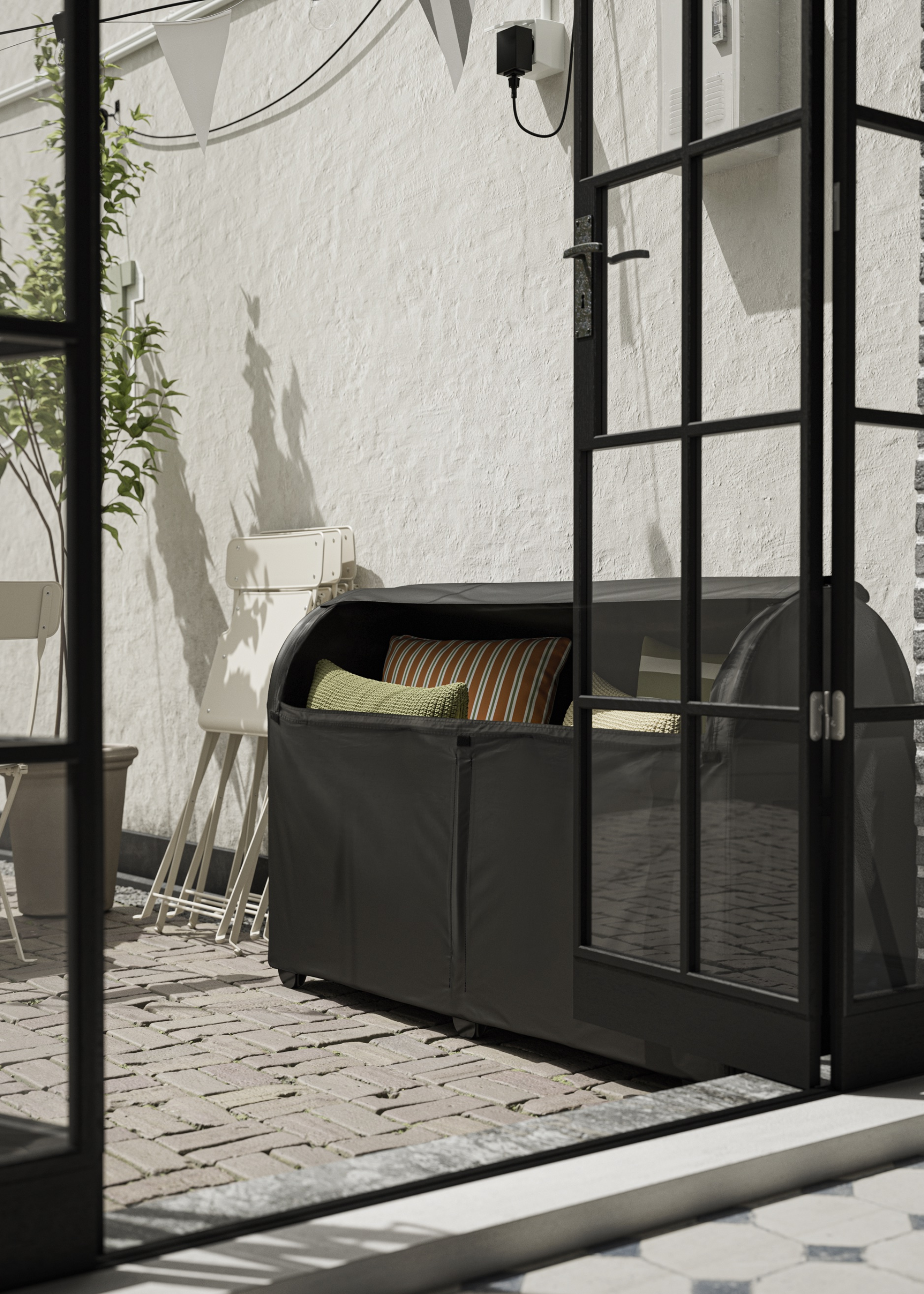 outdoor storage box in a modern garden with a folded chair beside it