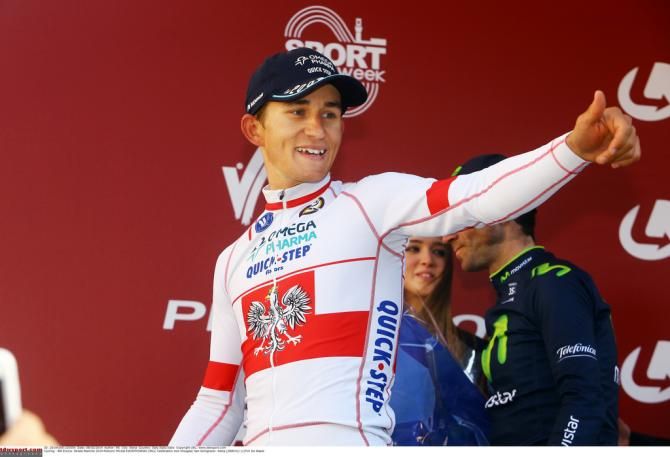 Michal Kwiatkowski makes his way to the podium