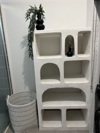 An empty customized IKEA kallax unit with textured rustic shelves