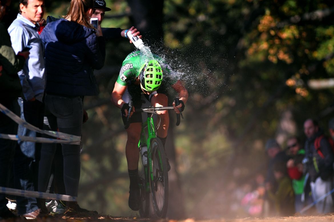 Tim Merlier gets a dousing of water, whether he wanted it or not