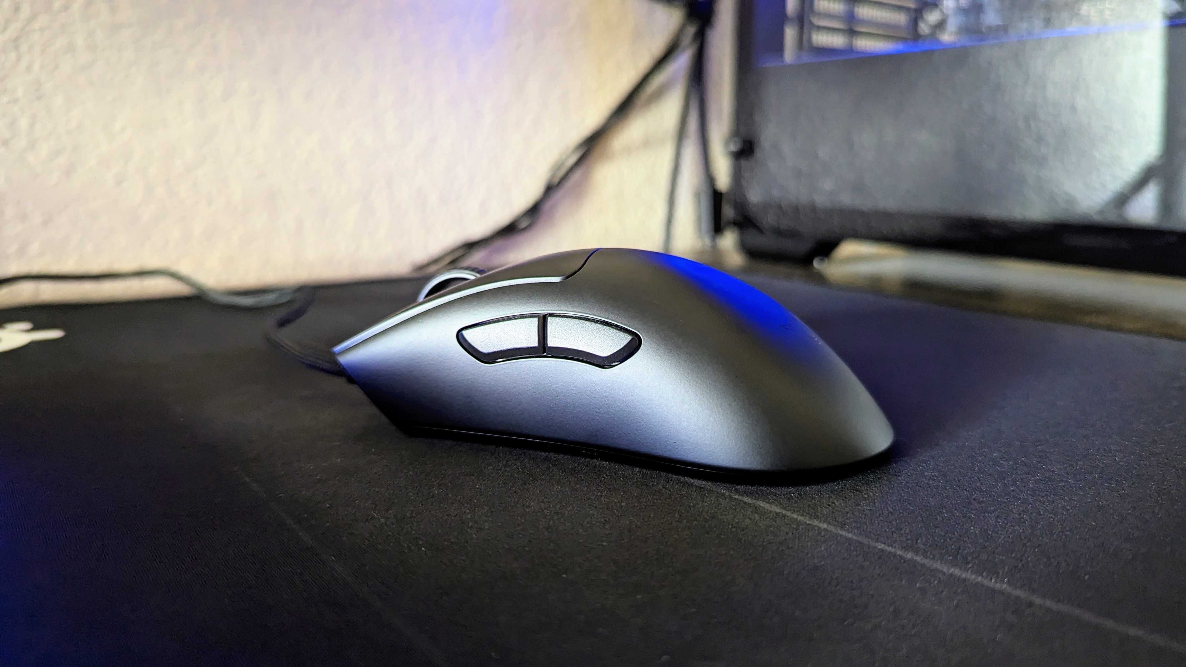 The Razer DeathAdder V3 on a mousepad, as seen from the side.