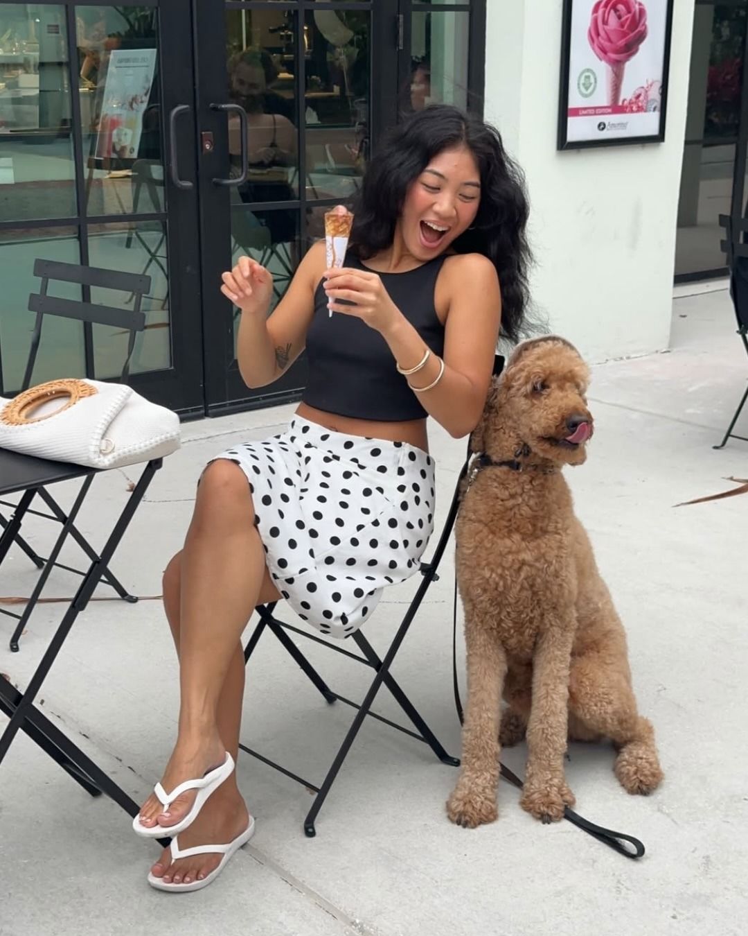 Fashion person @jeannine.roxas wears the Archie's Arch support flip-flops in white. She styles with a polka dot midi skirt and black tank top.