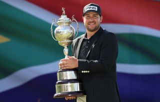 Thriston Lawrence holding the trophy after winning South Africa Open