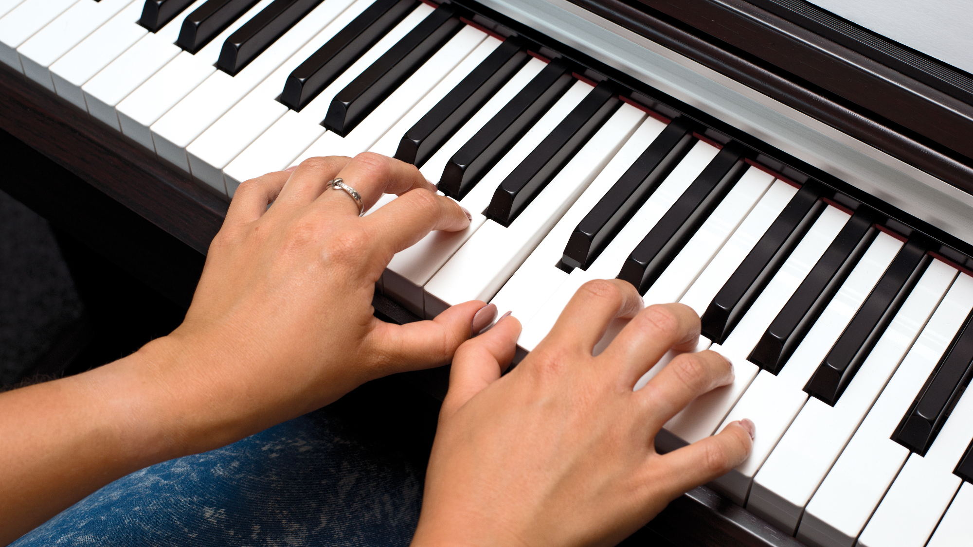 Lady playing Yamaha piano