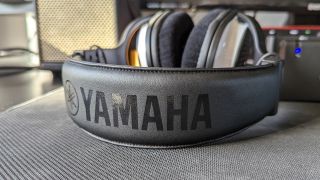 The Yamaha log on the headband of the Yamaha YH-WL500 wireless headphones