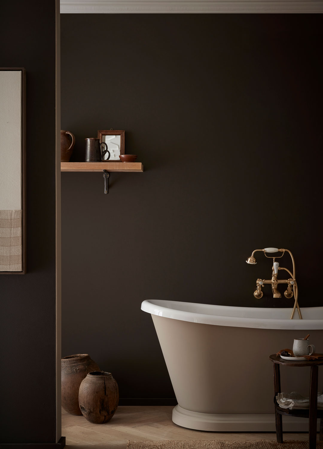chocolate brown bathroom with taupe freestanding bath