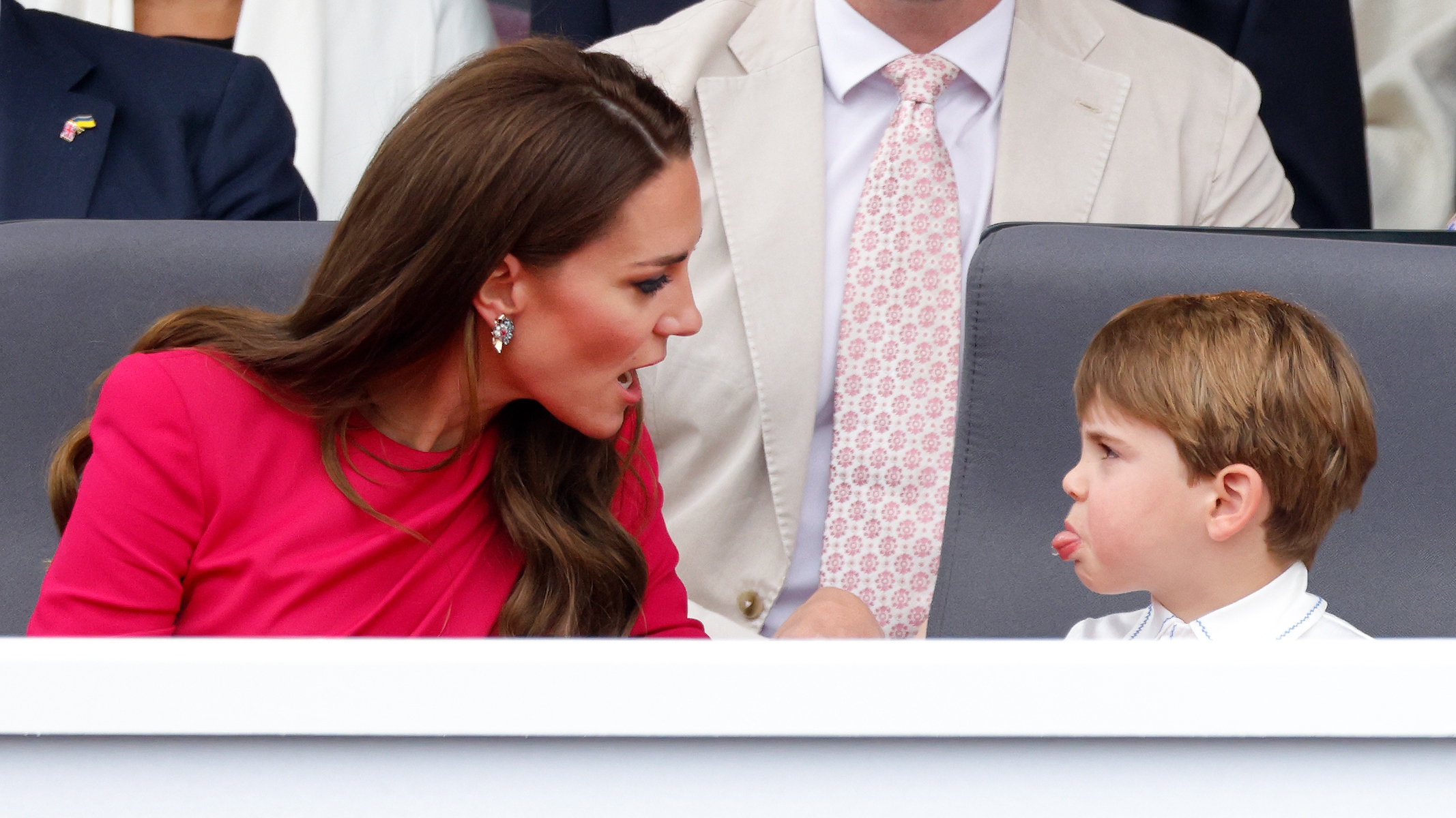 Prince Louis sticks his tongue out at his mother Catherine as they attend the Platinum Pageant on The Mall on June 5, 2022