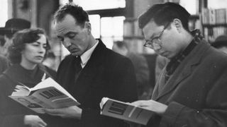 Group of men reading Lolita at the book shop