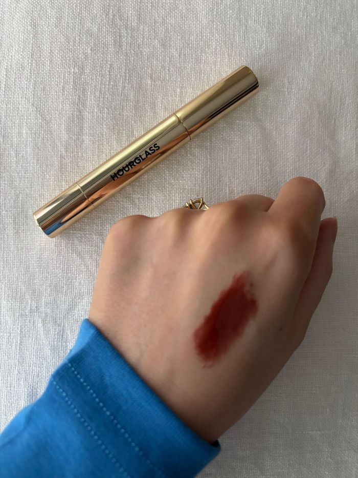 Deputy beauty editor Grace Lindsay swatching the Hourglass Phantom Volumizing Glossy Balm