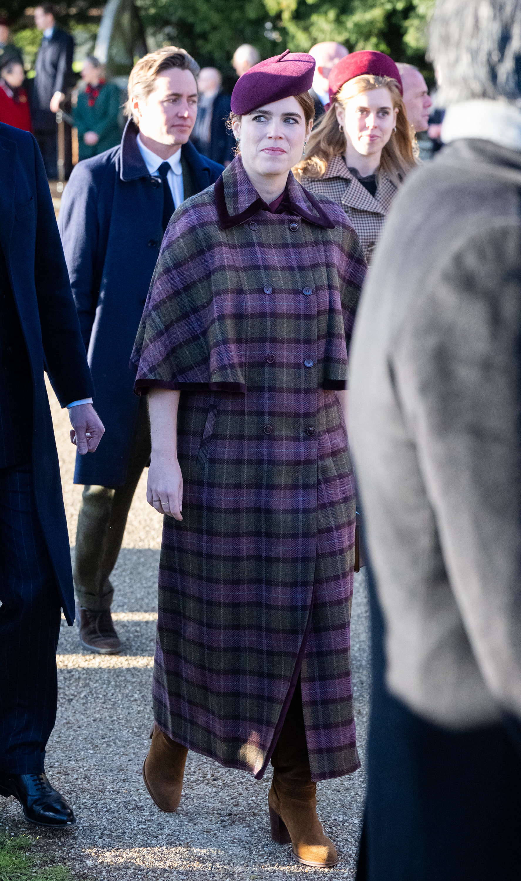 Princess Eugenie wearing a purple plaid coat on Christmas Day 2025