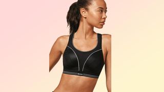 a photo of a woman wearing the Shock Absorber Ultimate Run Bra