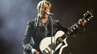 David Bowie performs on stage on the third and final day of "The Nokia Isle of Wight Festival 2004" at Seaclose Park, on June 13, 2004 in Newport, UK.