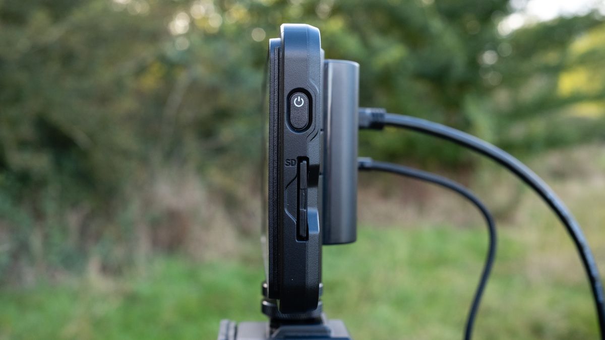 View of. the ports on the side of an Atomos Shinobi II camera monitor outside in a field