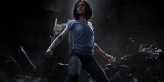 Alita: Battle Angel Alita stands ready to fight in the underground ruins of Iron City