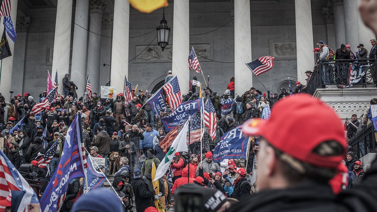 Trump supporters take the steps on the east side of the US Capitol building on January 06, 2021 in Washington, DC.