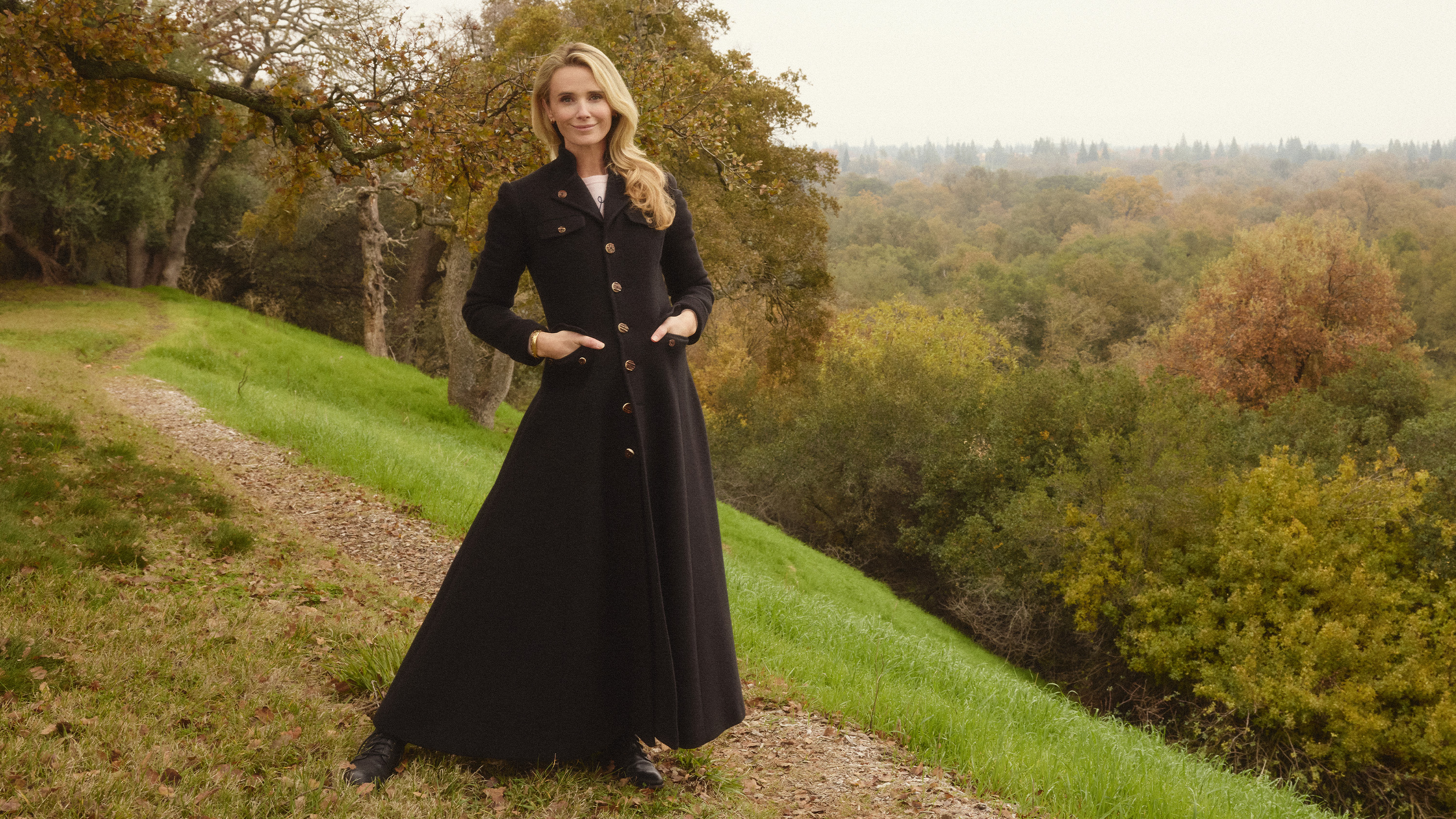 Jennifer Siebel Newsom standing in a field in a photograph by Marie Claire