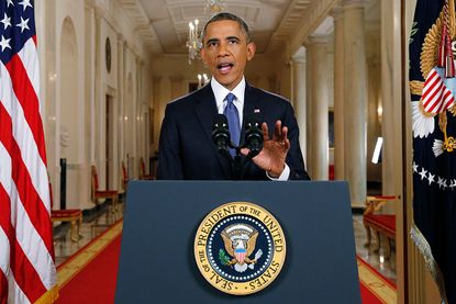 Barack Obama addresses the public from the White House.