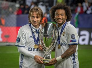 Lucas Modric and Marcello Real Madrid celebrate victory with Carlos Henrique Casimiro after the UEFA Super Cup match between Real Madrid and Sevilla at the Lerkendal Stadion on August 9, 2016 in Trondheim, Norway.