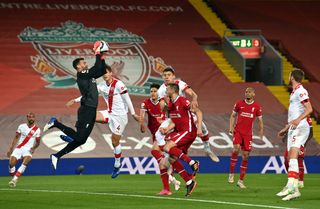 Liverpool goalkeeper Alisson saves a shot against Southampton