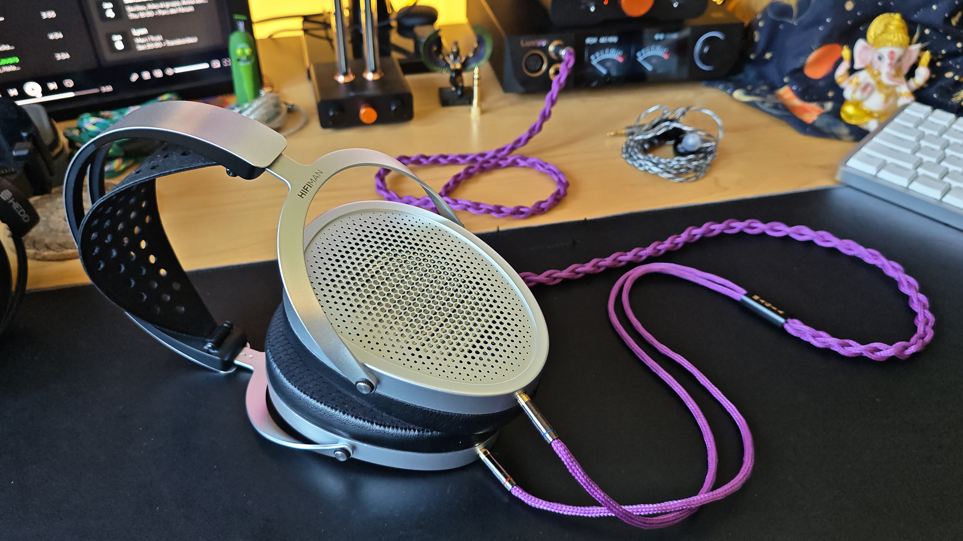 HiFiMan Edition XV headphones on a desktop, with a purple cable.