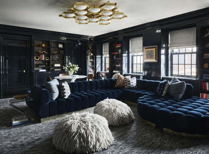 A living room with a blue and grey color combination