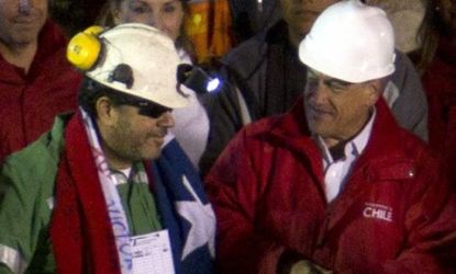 The last of the 33 rescued miners greets Chilean president Sebastian Pinera.