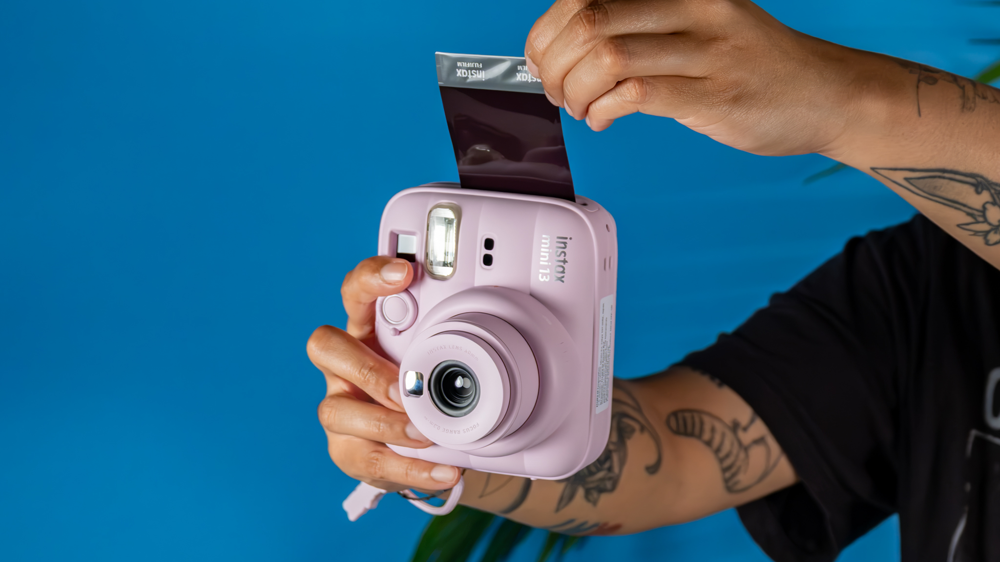 A Candy Pink Fujifilm Instax mini 13 instant camera