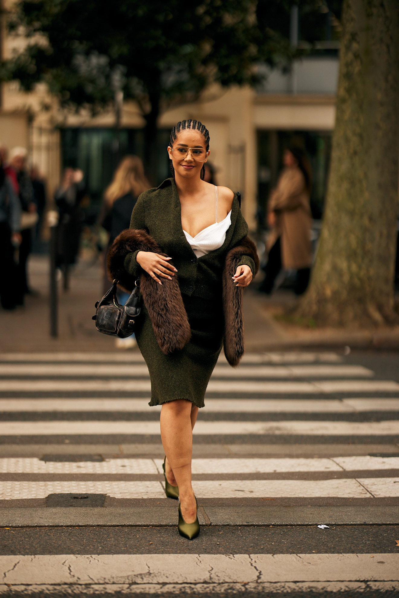 Woman in olive green sweater