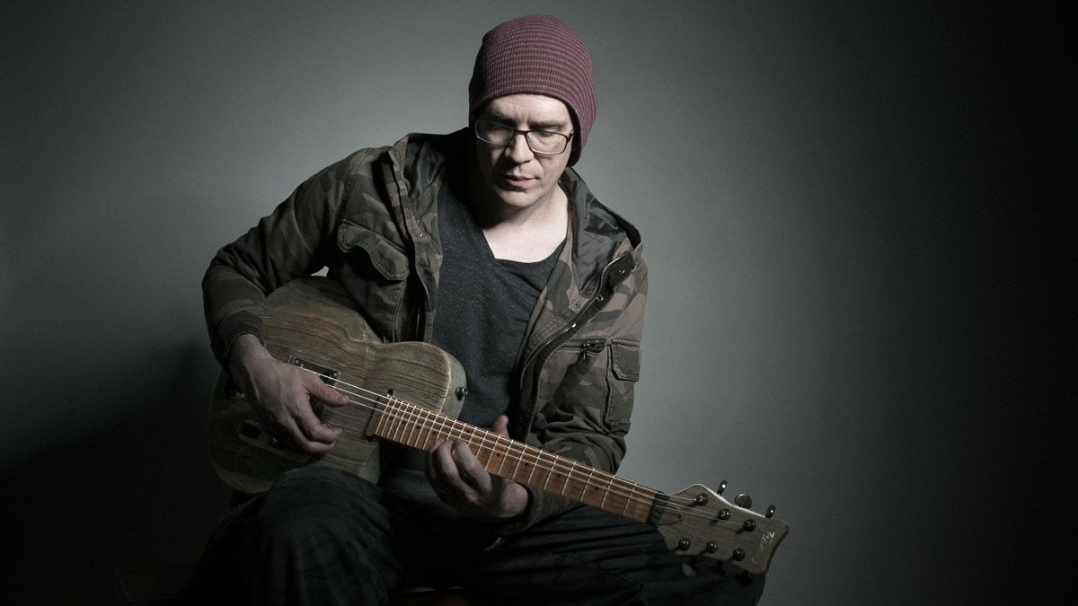 Devin Townsend playing acoustic guitar