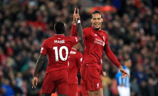 Sadio Mane celebrates scoring Liverpool’s second goal against Huddersfield with Virgil van Dijk