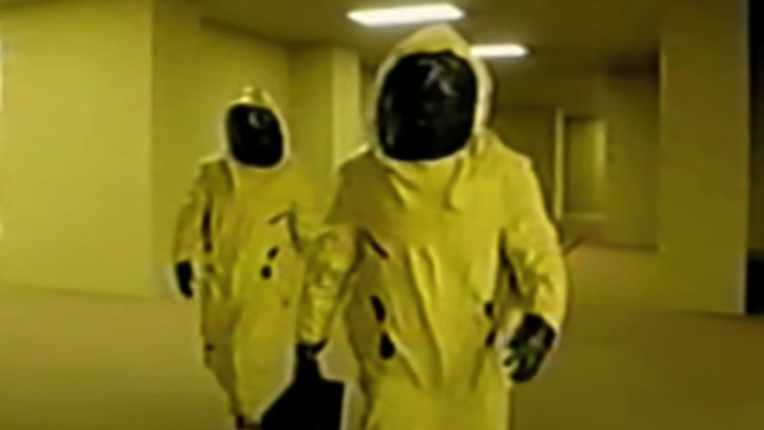 Two Async employees walking in the Backrooms