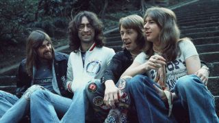 Bad Company sitting on steps in Japan in 1975