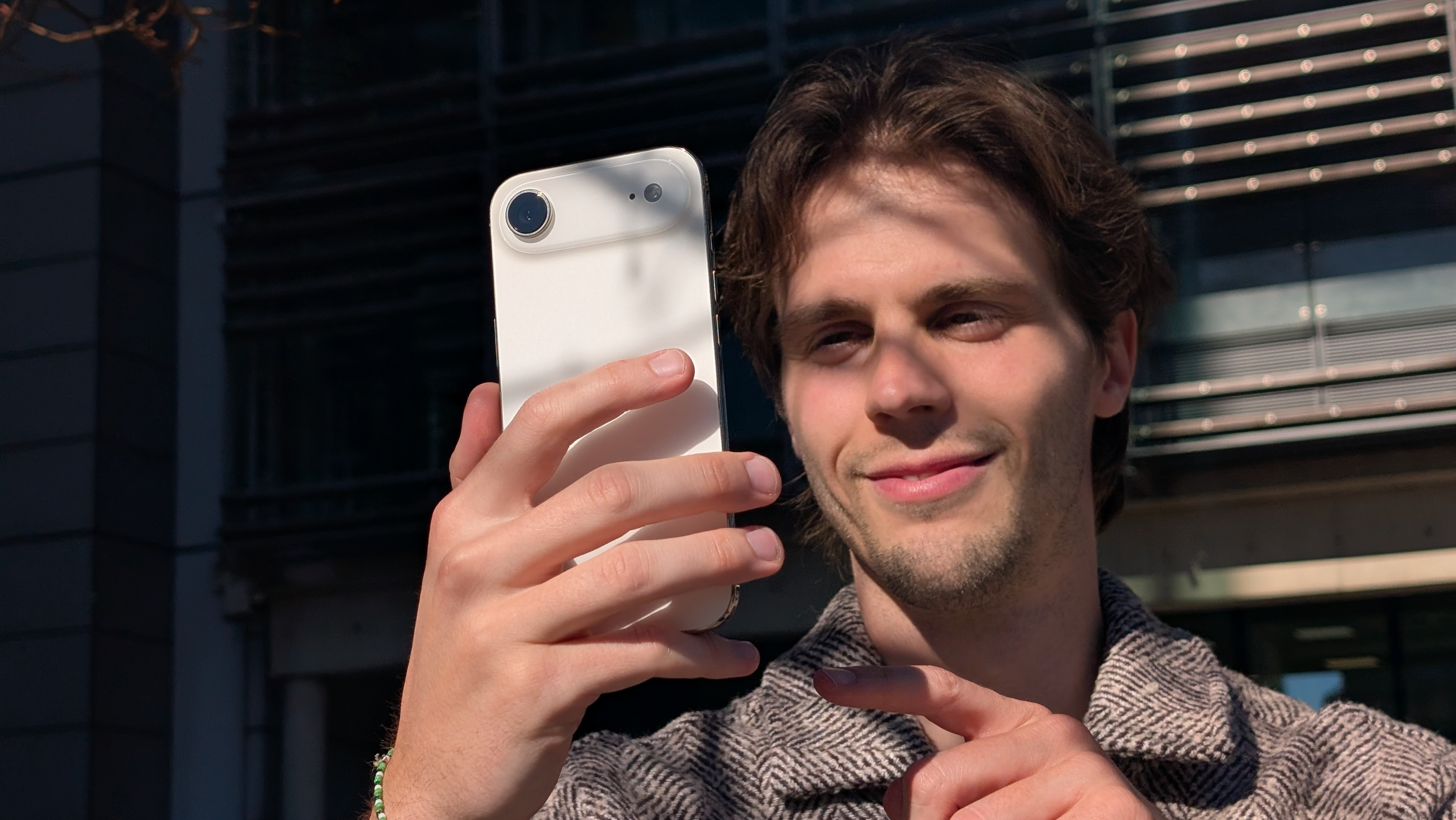 Man holding the iPhone Air in portrait