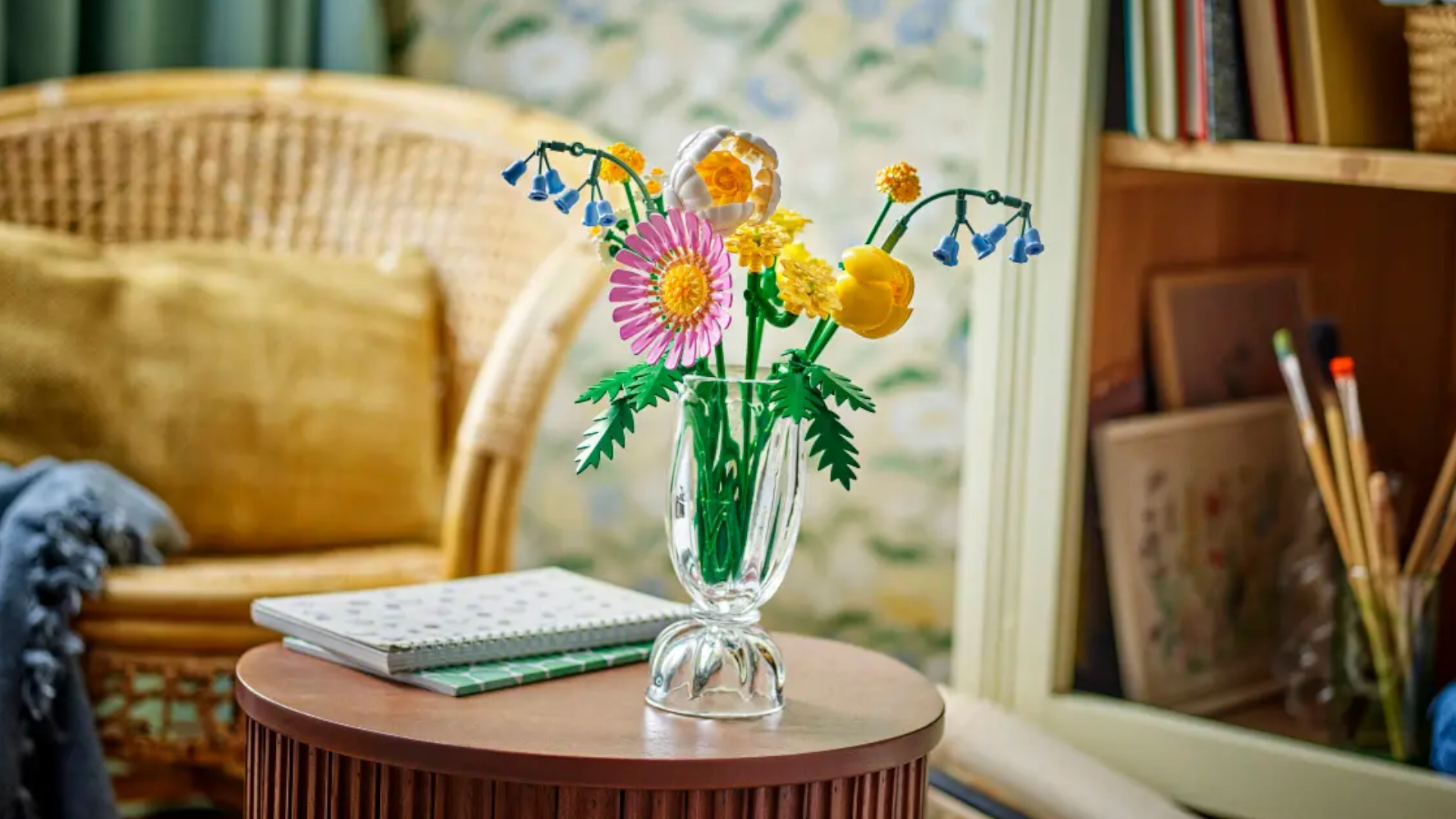 Lego Petite Sunny Bouquet (10347) in a glass vase on a wooden side table