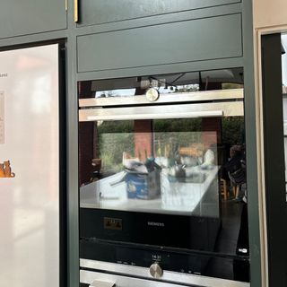 Siemens built in oven in a blue kitchen