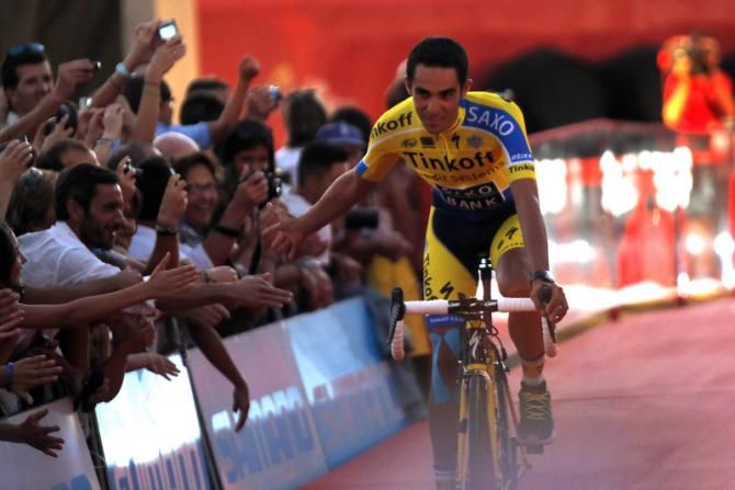 Alberto Contador high-fiving his fans