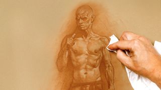 How to draw a figure: Artist with paper under their drawing hand