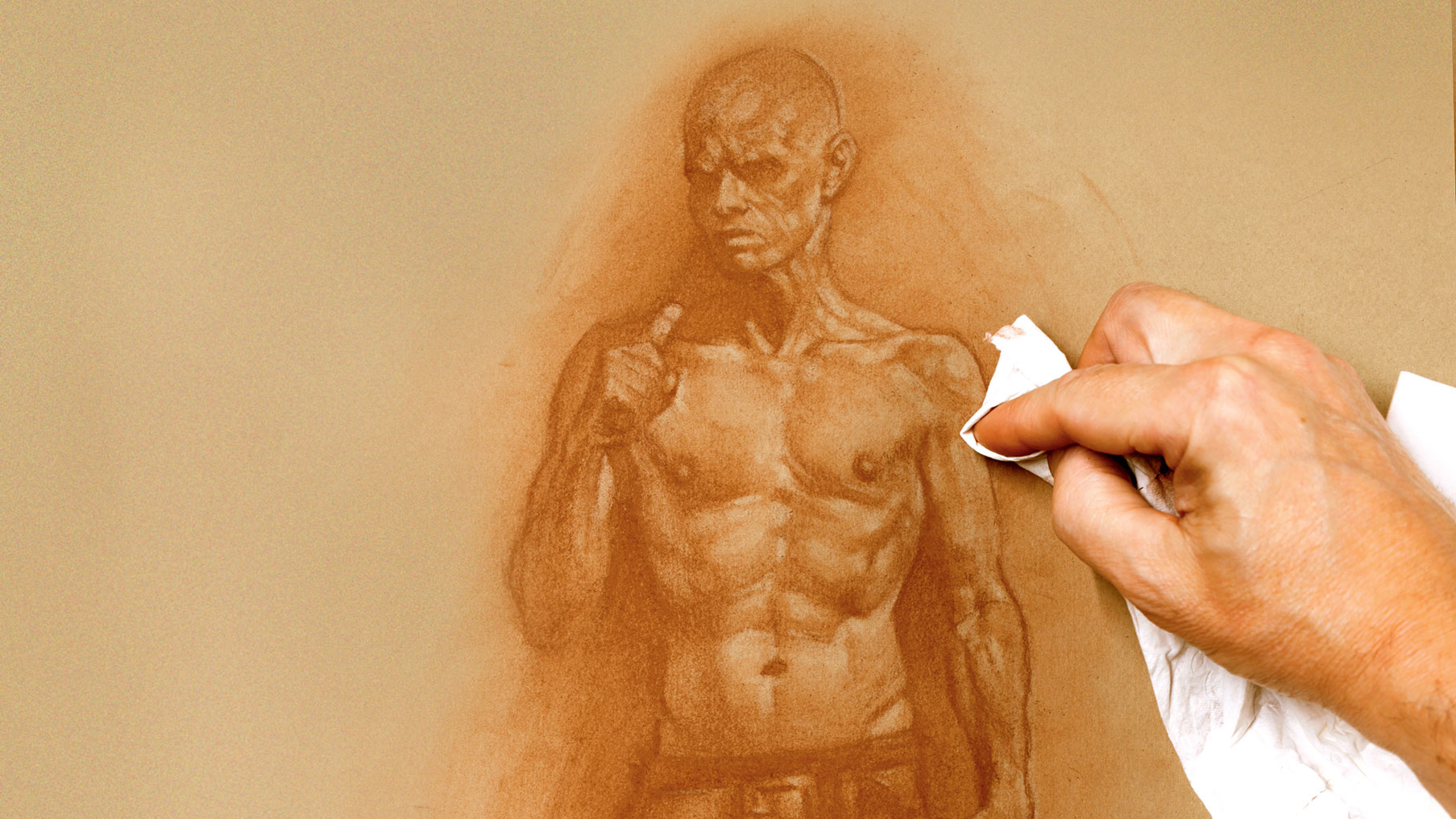 How to draw a figure: Artist with paper under their drawing hand