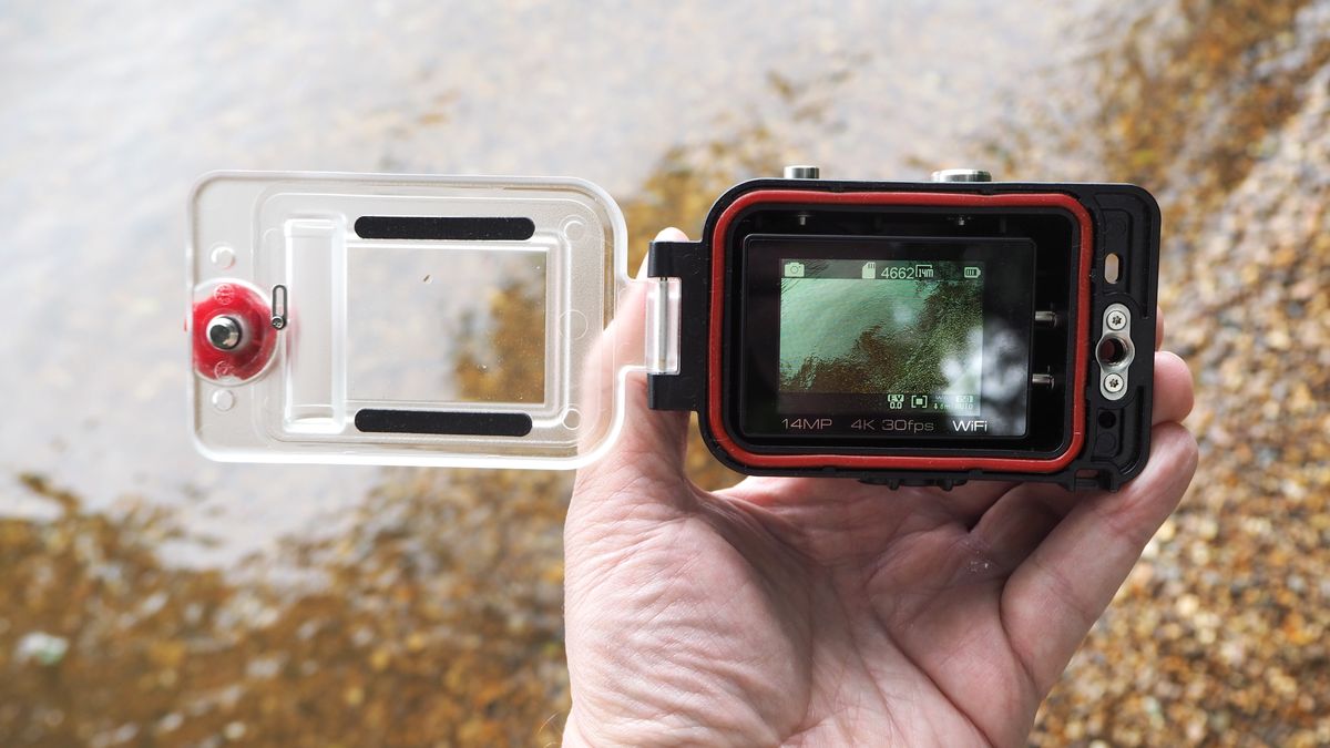 SeaLife ReefMaster RM-4K waterproof camera on a stony waterside
