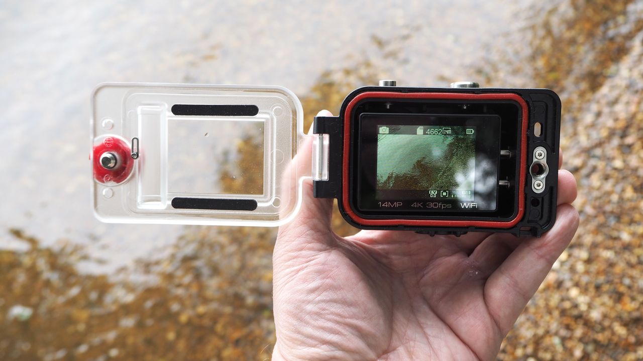SeaLife ReefMaster RM-4K waterproof camera on a stony waterside